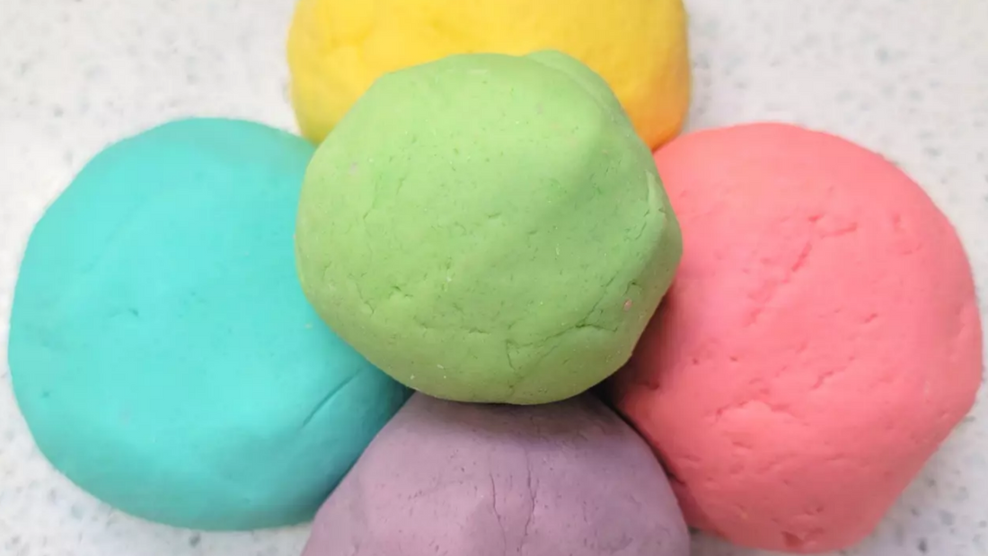 5 balls of homemade playdough in assorted colors