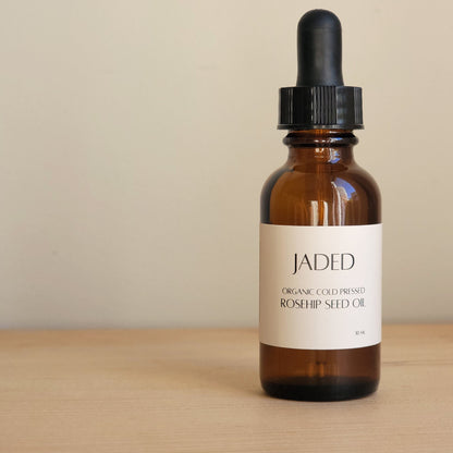 Bottle of organic rosehip seed oil in glass bottle