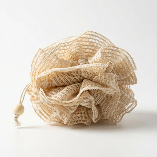Beige ramie bath pouf with a wooden bead on a white background