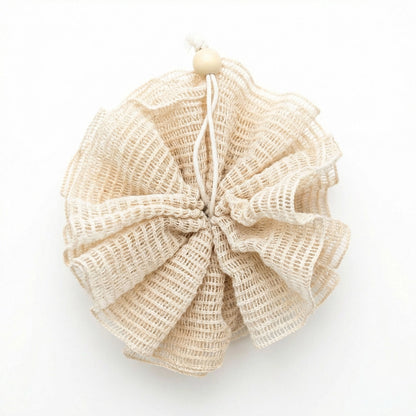 Beige ramie natural bath pouf on a white background